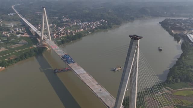 广西新桥打破物理定律：无配重毫米级合龙成就‘奇迹’